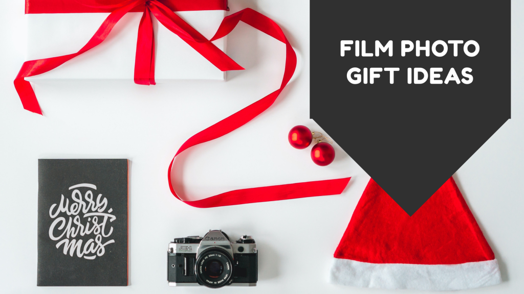 2020 gift ideas for film photographers with a hat, a camera and a notebook.