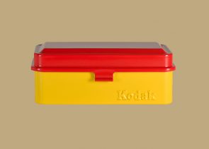 Kodak film case with a red top and yellow base.